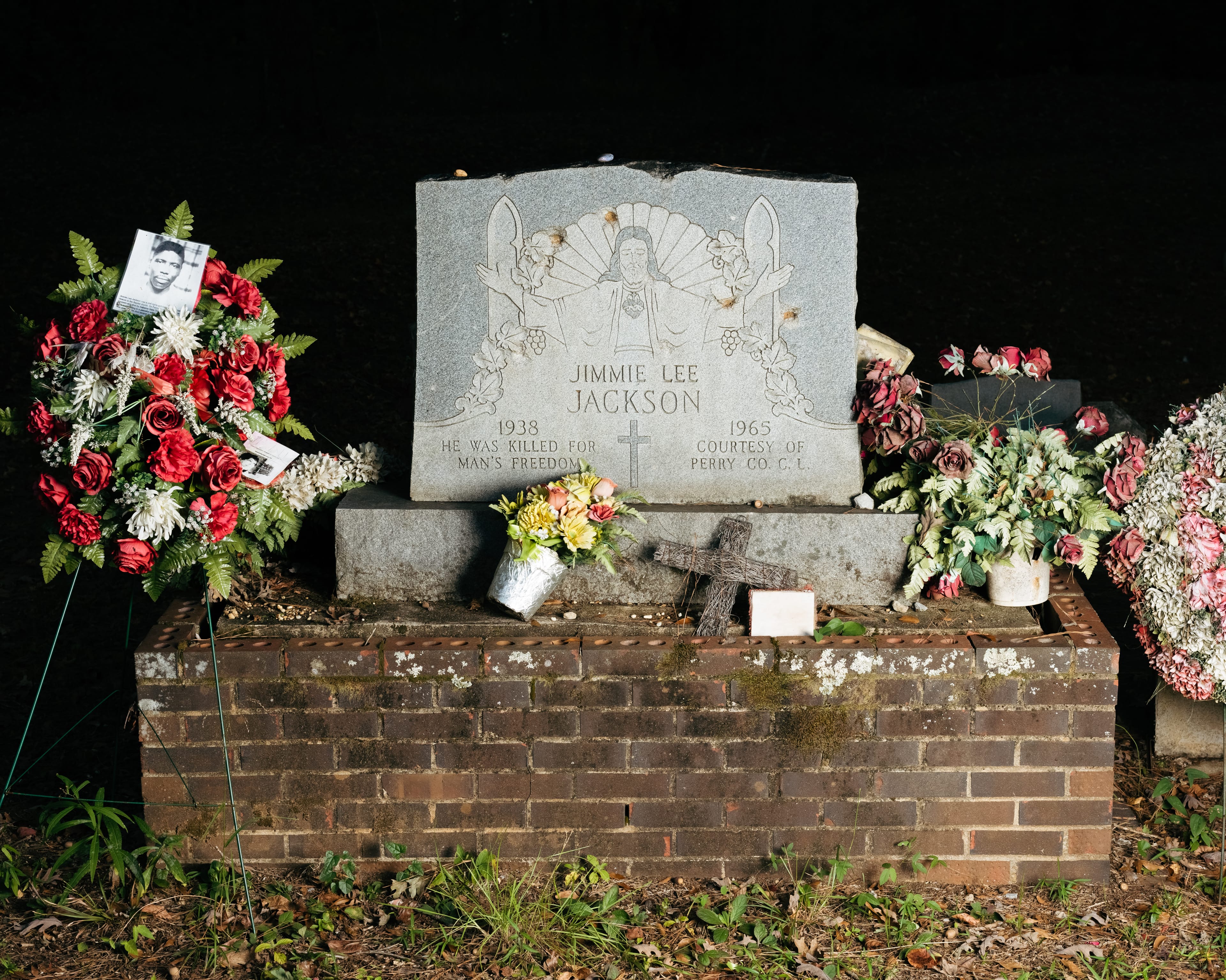Jimmie Lee Jackson's grave at the Heard Cemetery adorned with flowers.